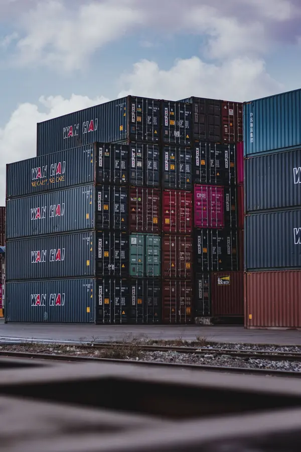 Stacked shipping containers ready for onward freight
